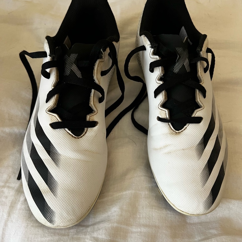 Adidas unisex soccer cleats. Black and white.